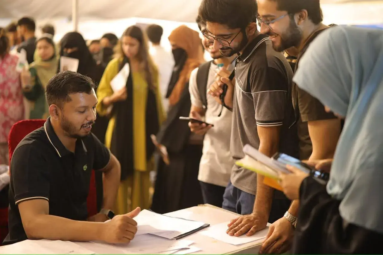 Stack360 team speaking with students at a UET recruitment drive booth