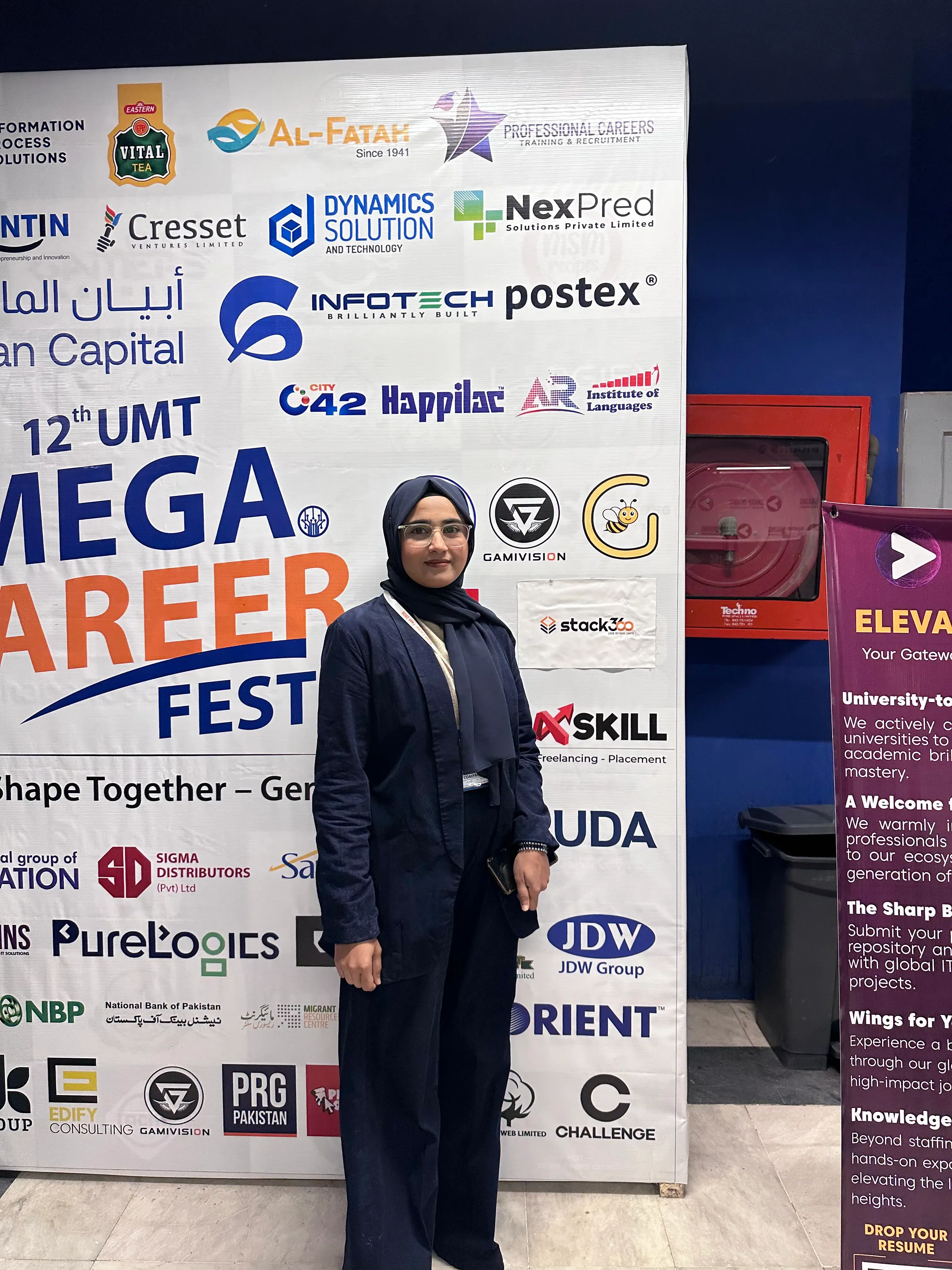 Stack360 team member at the 12th UMT Mega Career Fest backdrop